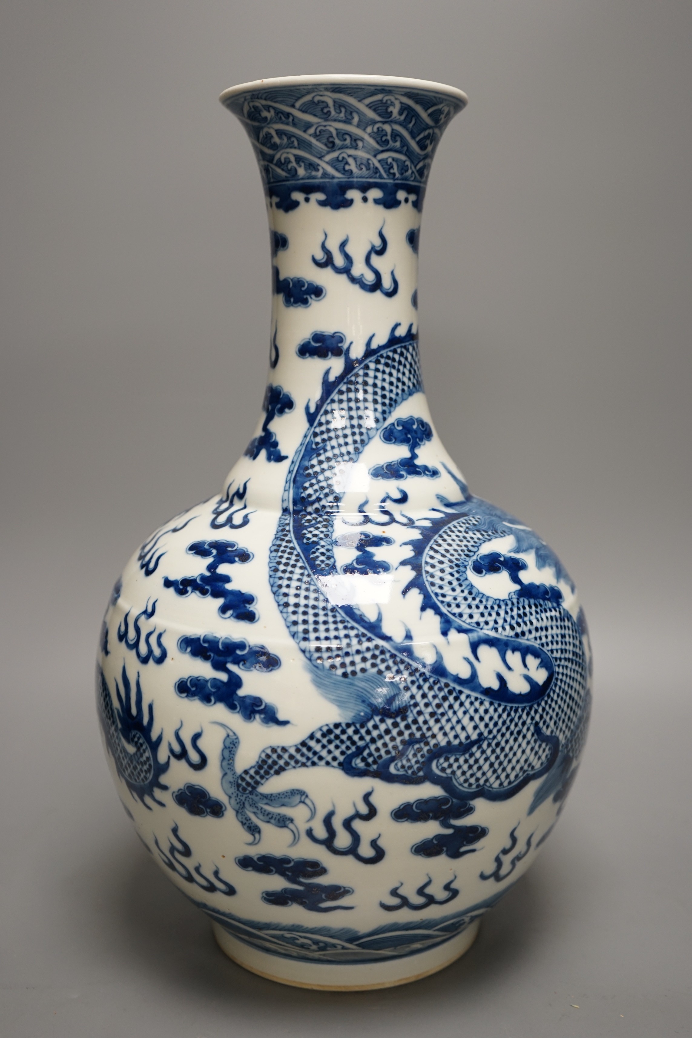 A Chinese blue and white 'dragon' bottle neck vase, 39.5cm tall